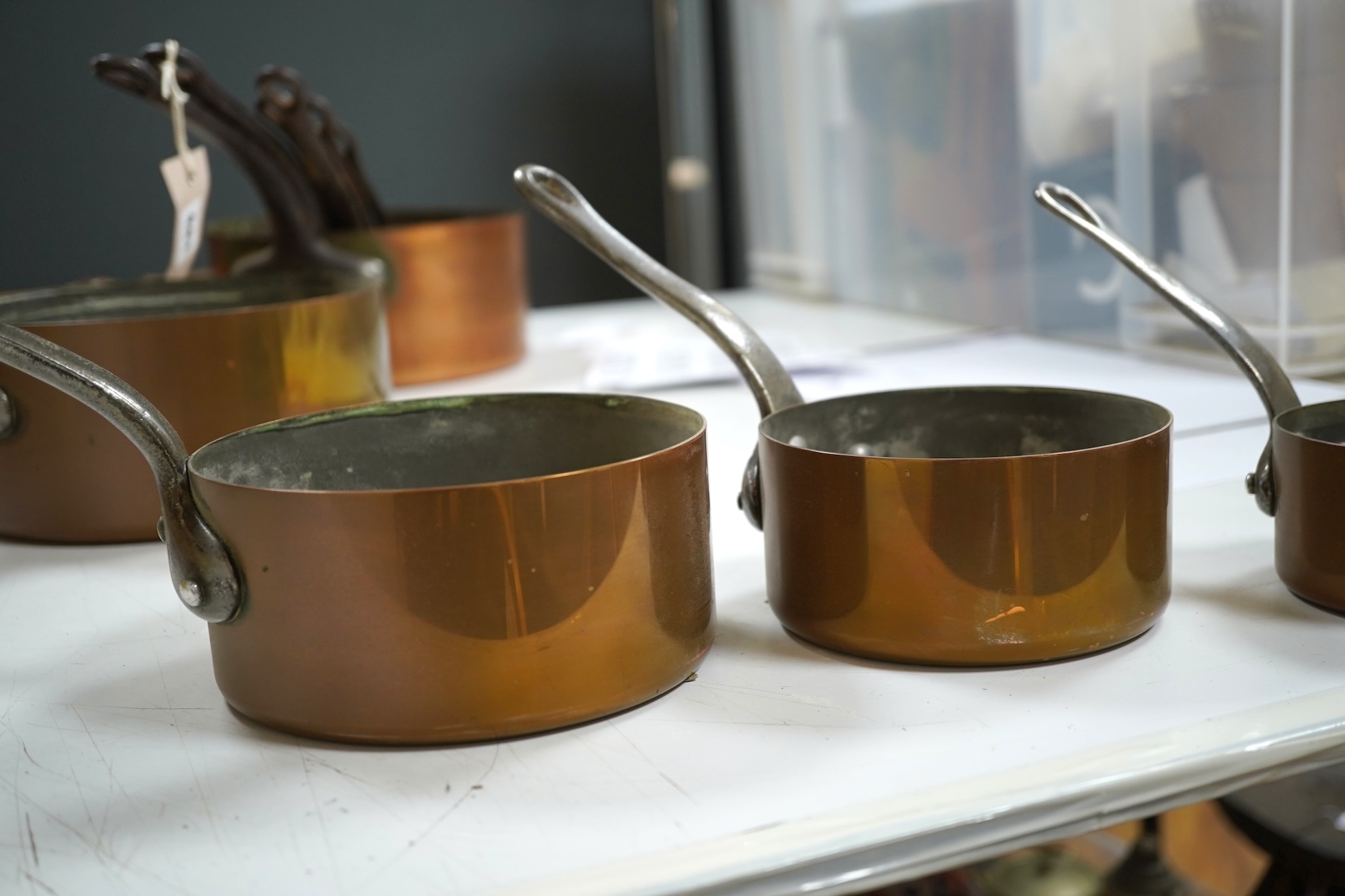 A graduated set of five French copper pans